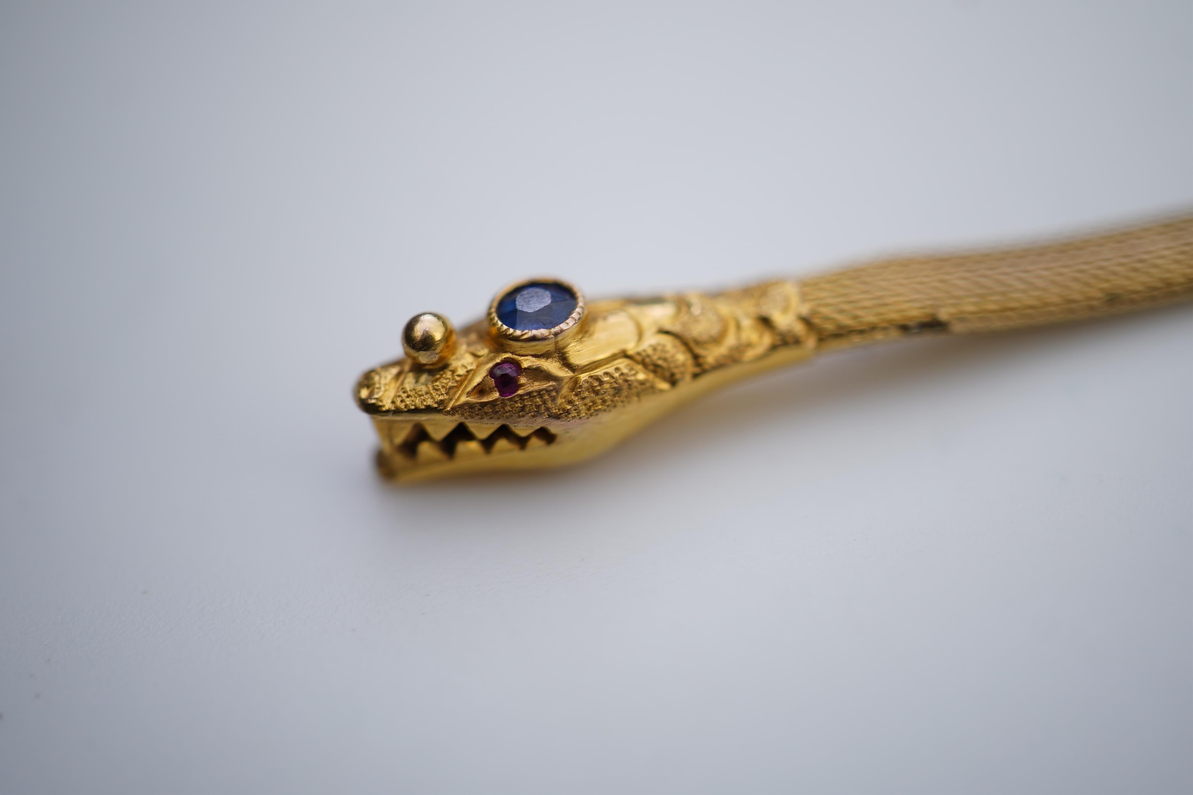 A Victorian gold, ruby and sapphire bracelet, mid 19th century
